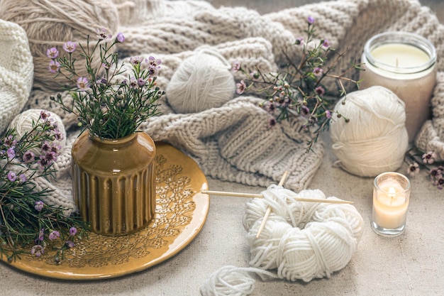 Free photo cozy home composition with threads for knitting