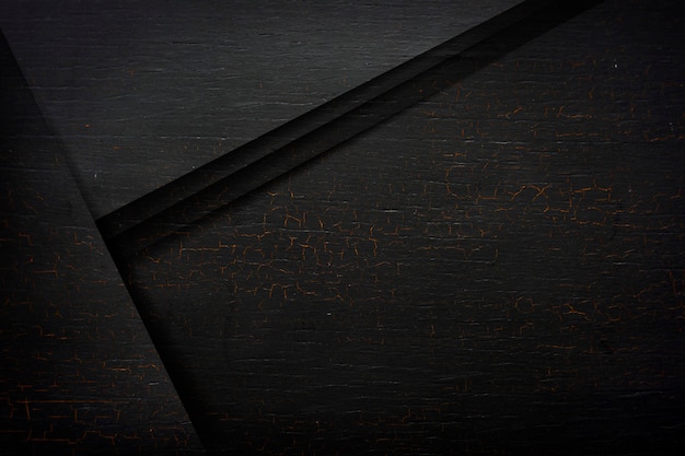 Free photo cracked black wooden textured background