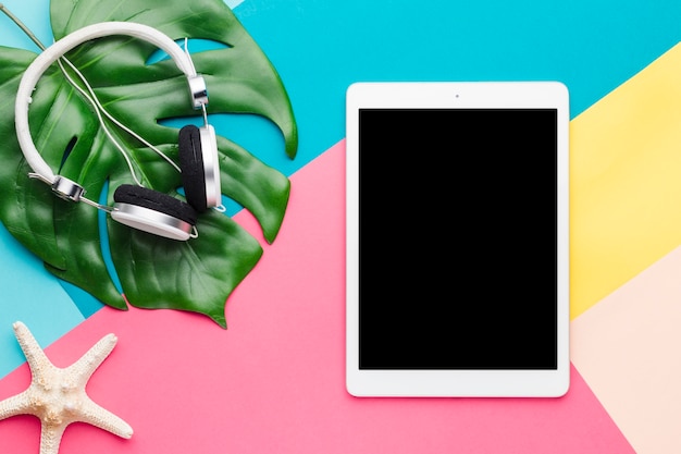 Free Photo creative layout of tablet and headphones