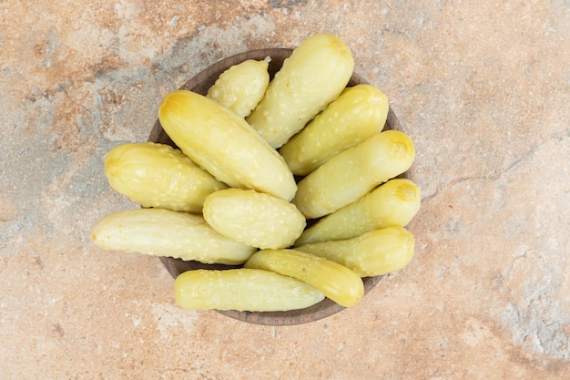 Free Photo crunchy pickled cucumbers in wooden bowl. 