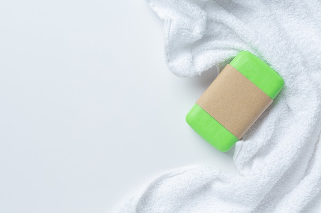 Free photo cucumber slices and soap on white background