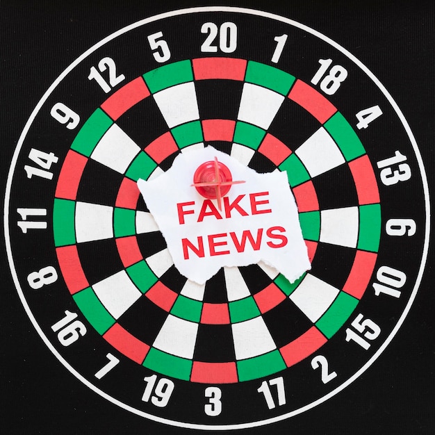 Free photo dartboard with fake news