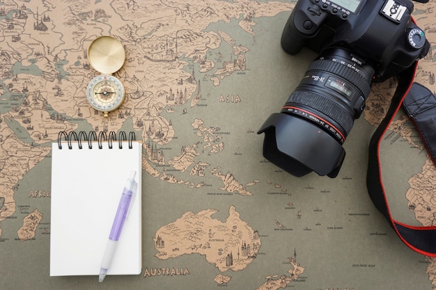 Free photo decorative composition with blank notebook and travel items