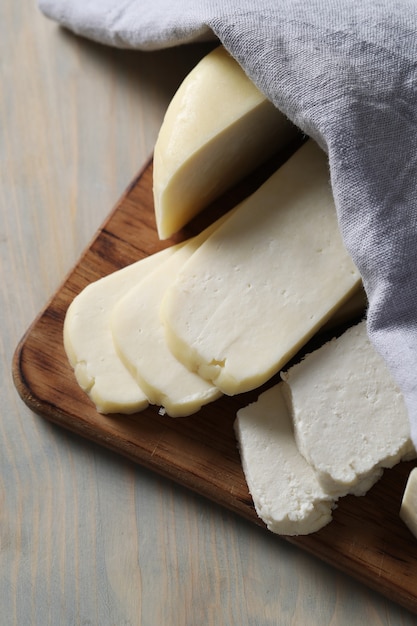 Free photo different types of cheese on cutting board