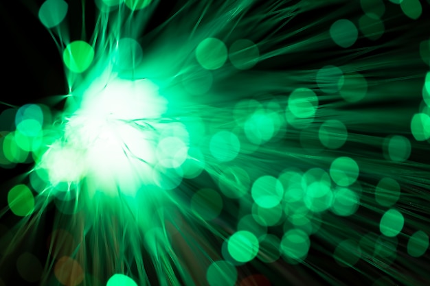 Free photo digital optical fibers in blurred green shades