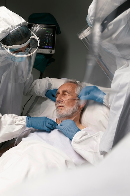 Free Photo doctor checking a patient's respiratory problems