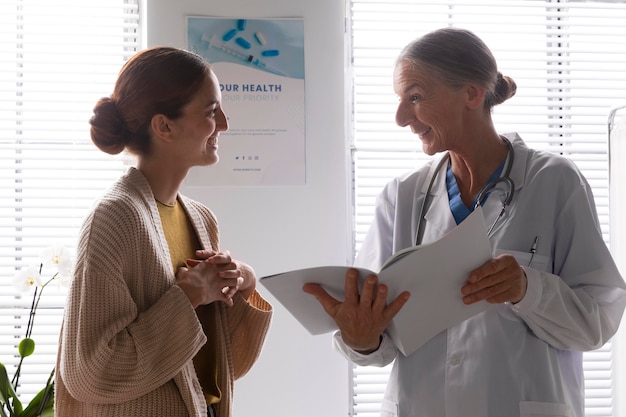 Free Photo doctor talking to a patient's wife