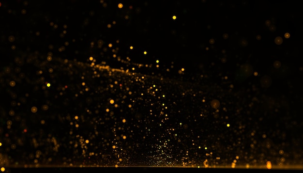 Free photo dynamic golden particle flowing dust background