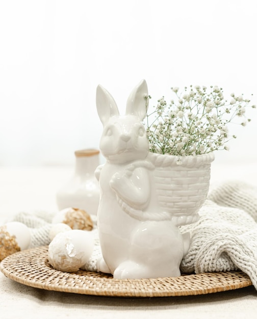 Free Photo easter composition with a ceramic hare and eggs