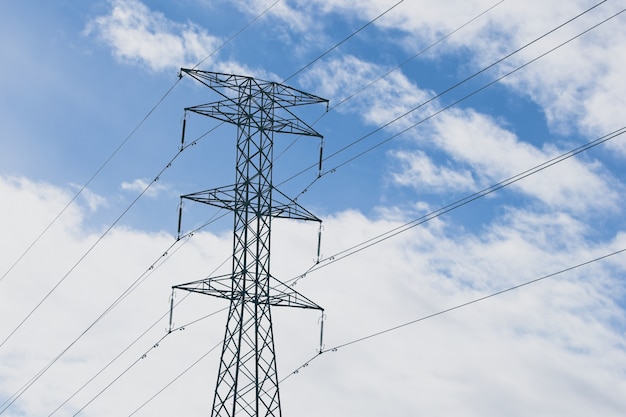 Free Photo electric towers with a blue cloudy sky in the background