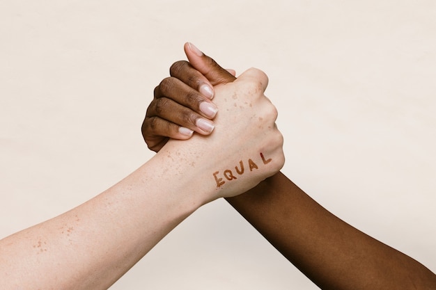 Free photo equal word on two hands joining together