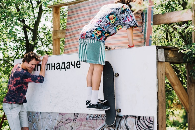 Free Photo extreme men jumping on ramp