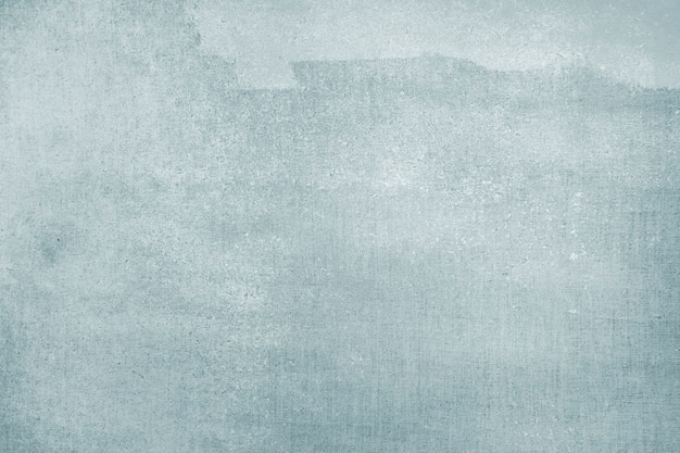 Free photo faded blue color on a canvas textured background