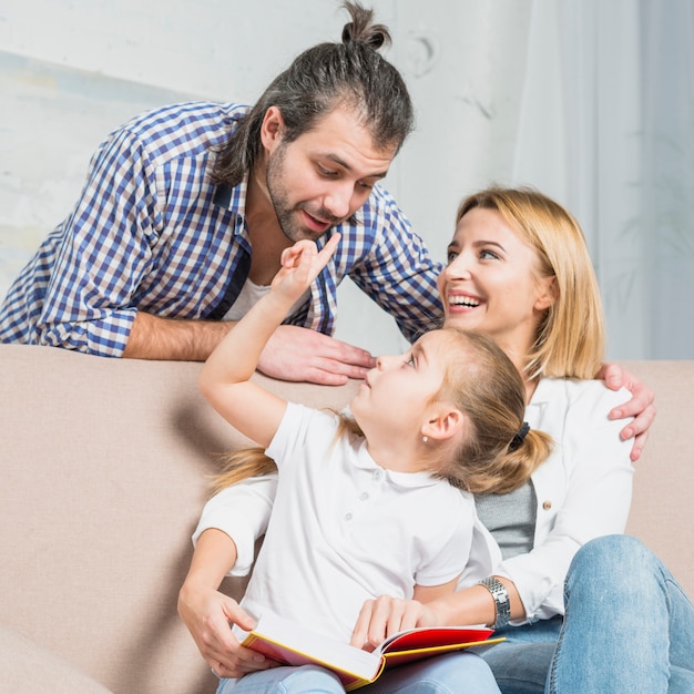 Free photo family playing on the sofa