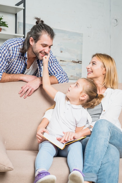 Free photo family playing on the sofa