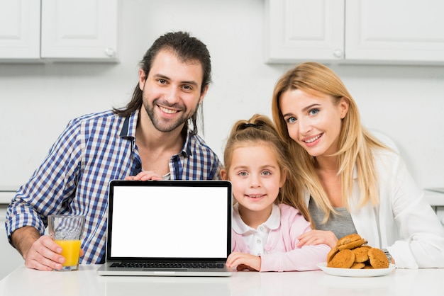 Free photo family portrait with cookies and juice