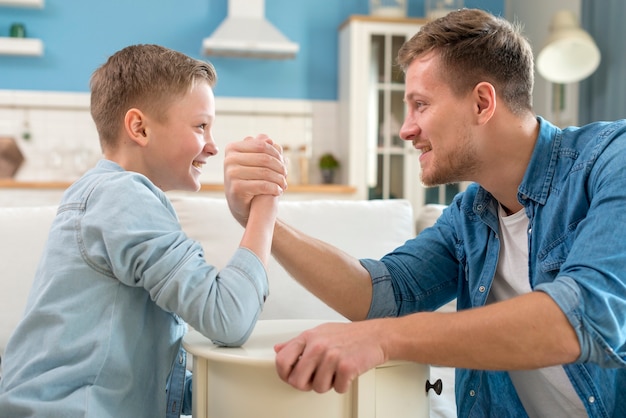 Father and child doing arm wrestling