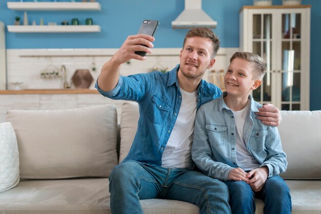 Father and son taking a selfie