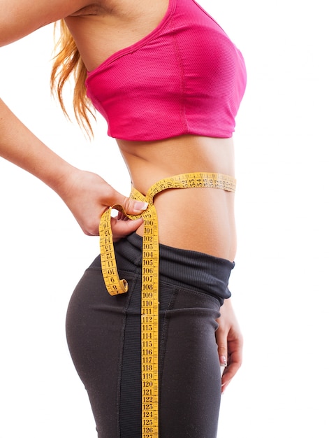 Free Photo female athlete being measured waist