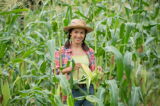 Free photo female farmer checking plants on his farm