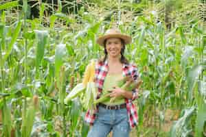 Free photo female farmer checking plants on his farm