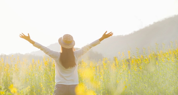 Free photo female teen girl stand feel freedom and relaxation travel outdoor enjoying nature with sunrise.