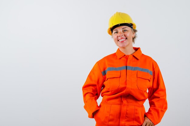 Free photo firewoman in her uniform with a safety helmet