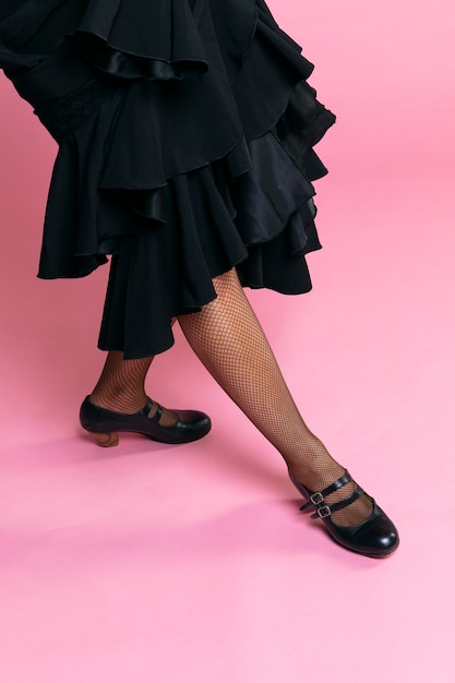 Free Photo flamenco dancer posing legs on pink background