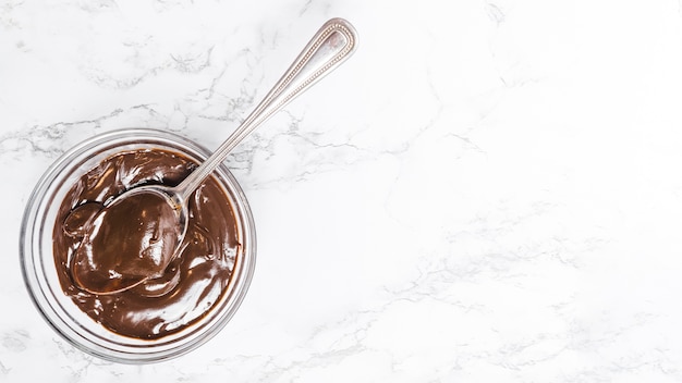 Free photo flat lay chocolate pudding in a bowl