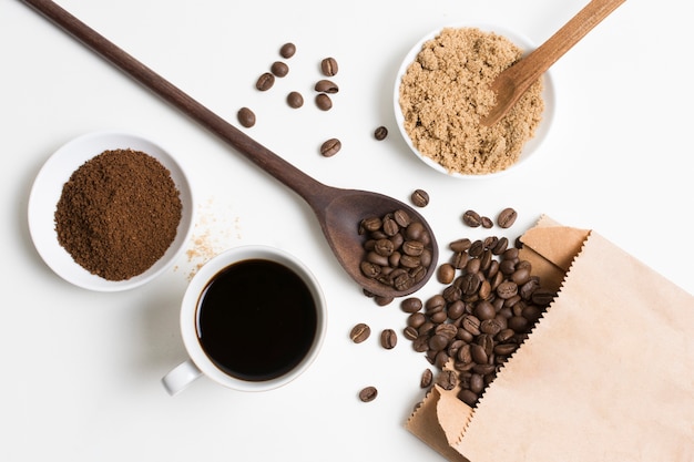 Free photo flat lay coffee beans and powder