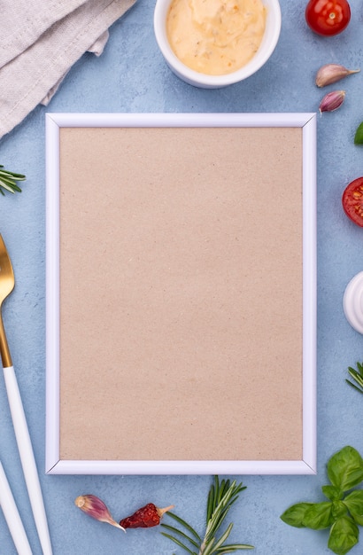 Free photo flat lay ingredients and frame on table