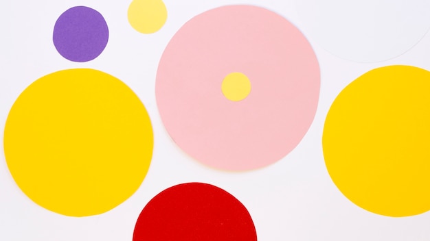 Free Photo flat lay of multicolored paper circles