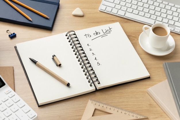 Free photo flat lay notebook with to do list on desk