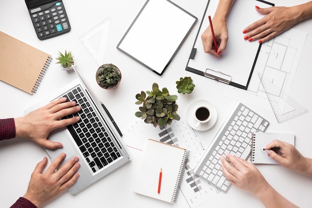 Free photo flat lay office desk assortment with empty screen tablet