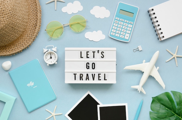 Free photo flat lay traveler tools on table