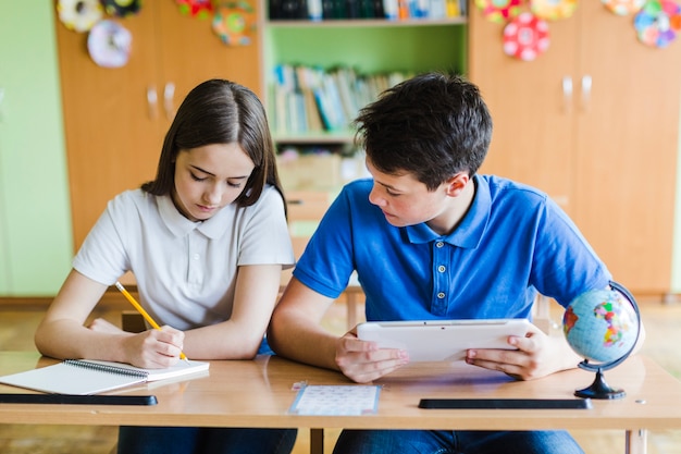 Free photo focused students at school