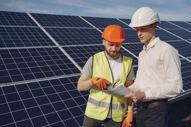 Free photo foreman and businessman at solar energy station.