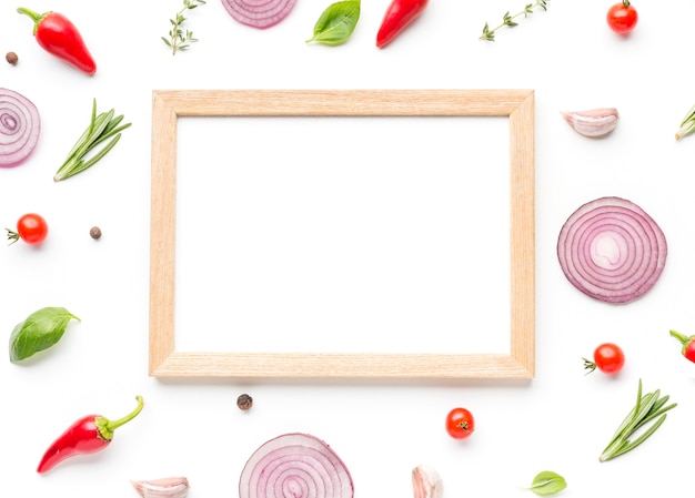 Free photo frame with ingredients and herbs on table