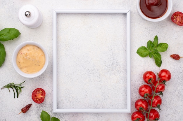 Free photo frame with tomatoes and souce