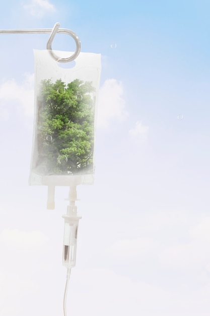 Free photo fresh air from trees in iv bag earth day media remix