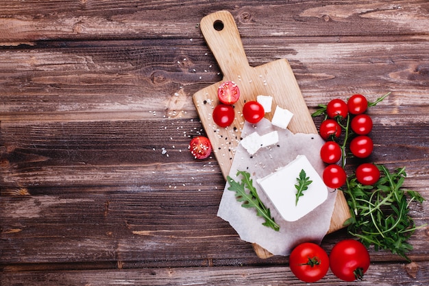 Free photo fresh and healthy food. delicious italian dinner. fresh cheese served on wooden board