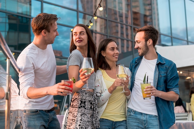 Friends posing with drinks