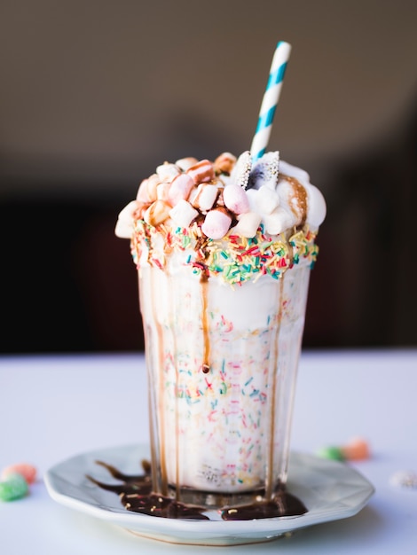 Free Photo front view of delicious milkshake on plate