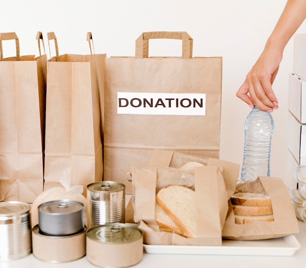 Free photo front view of donation bags for food day