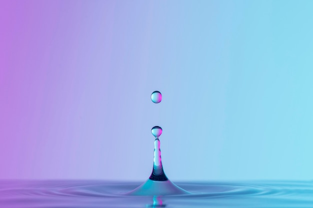 Free photo front view of liquid with drops and splash