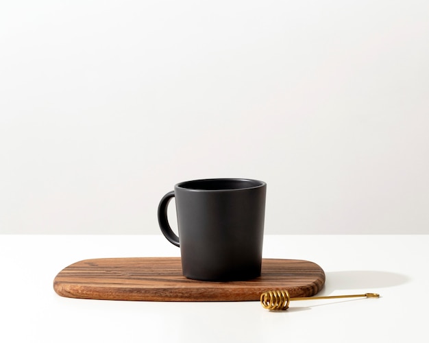 Free Photo front view of mug with spoon and copy space