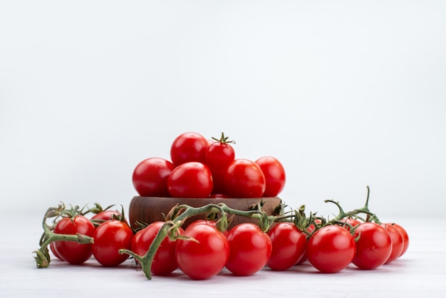 Free Photo front view red fresh tomatoes lined on white vegetable food meal raw freshness