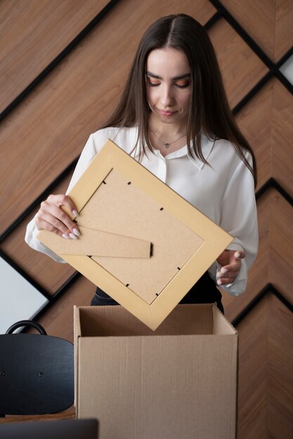 Front view woman holding frame