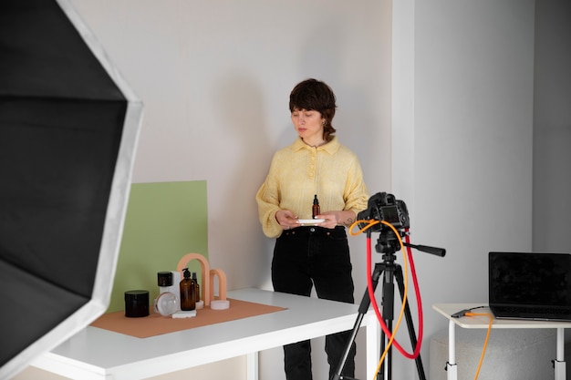 Front view woman working in photography studio