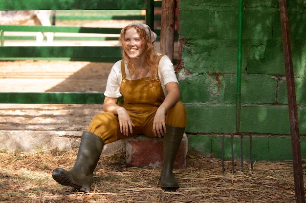 Free Photo full shot smiley woman at farm